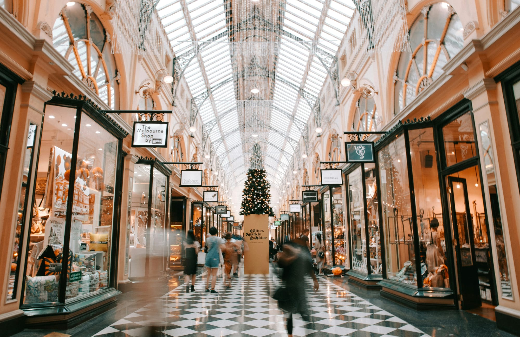 Photo of moving people in a mall.