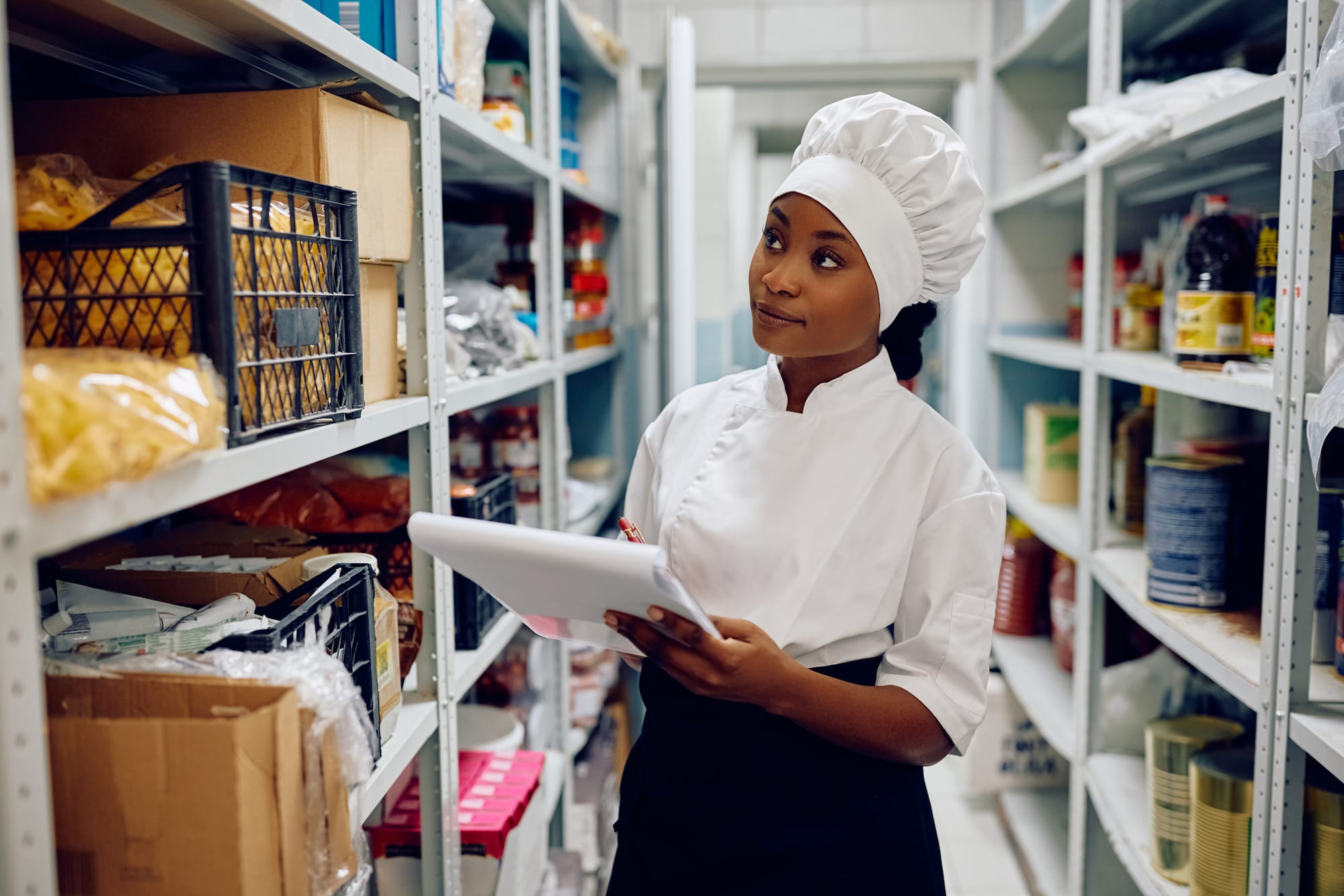 Restaurant Employee checking inventory storage